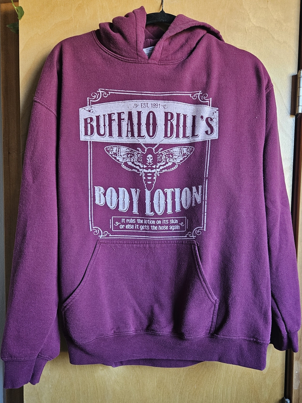 Gildan Wine Pullover Hoodie with White Buffalo Bill's Body Lotion Graphic
